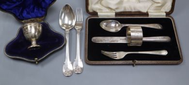 A George III silver spoon and fork christening set, by William Ely, London 1817, a cased knife,