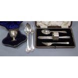 A George III silver spoon and fork christening set, by William Ely, London 1817, a cased knife,