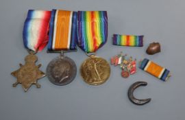 A WWI trio of medals and related items