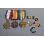 A WWI trio of medals and related items