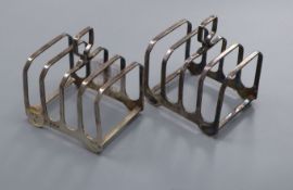 A pair of silver four division toast racks, by Elkington & Co, Birmingham 1959, 5oz.