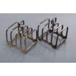 A pair of silver four division toast racks, by Elkington & Co, Birmingham 1959, 5oz.