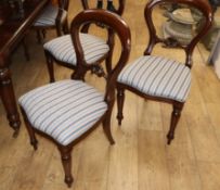 A set of eight Victorian style mahogany balloon back dining chairs