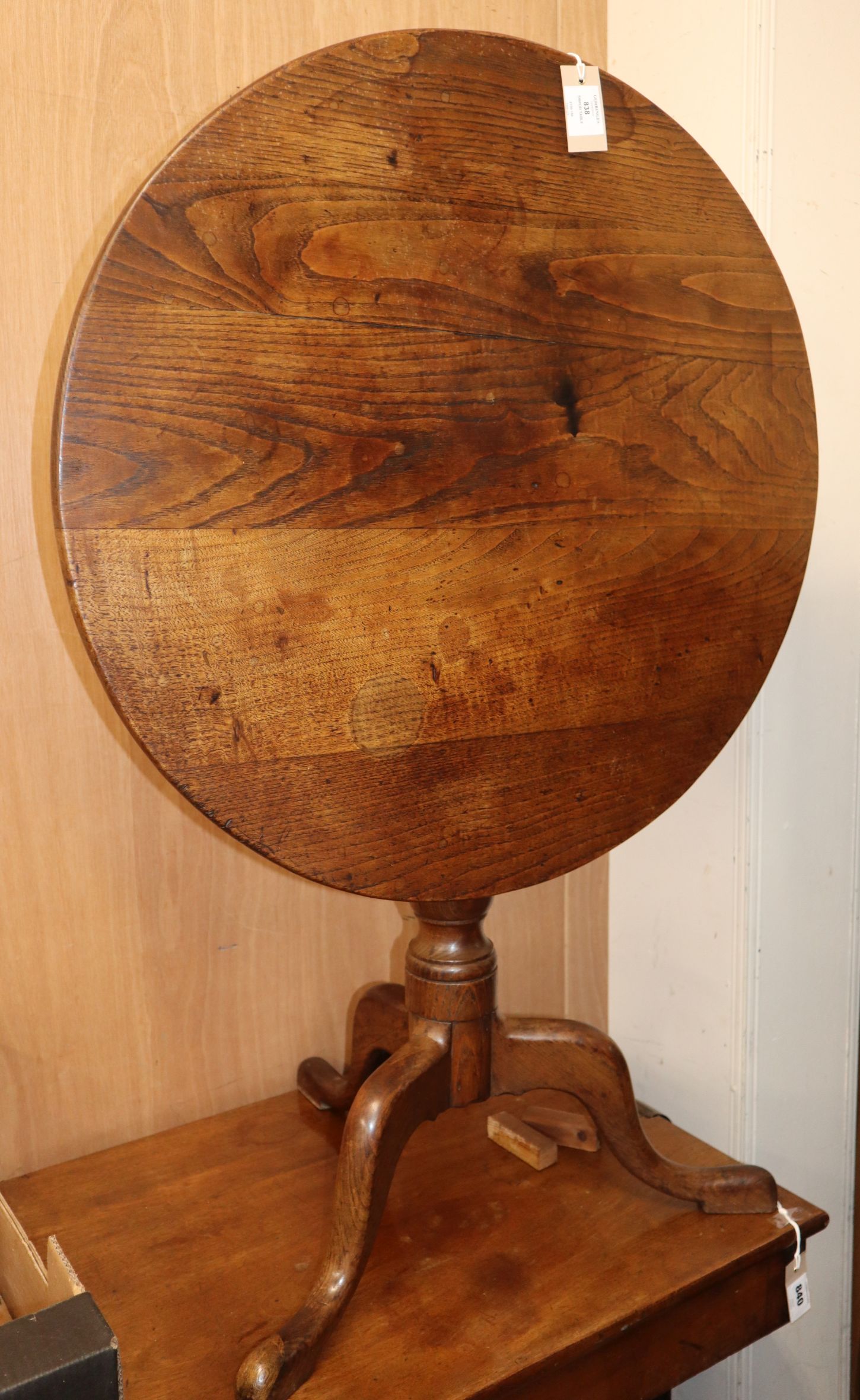 A George III oak circular tripod table W.75cm