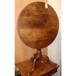 A George III oak circular tripod table W.75cm