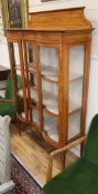 An Edwardian cross-banded satinwood display cabinet W.107cm