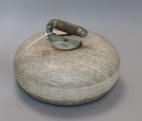 A vintage curling stone