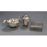 A silver sauceboat, a silver sugar sifter and a silver mounted glass toilet jar.