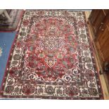 A North West Persian red ground rug 200 x 150cm