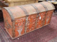 A 19th century painted iron mounted domed top trunk W.145cm