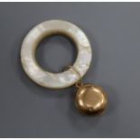 A Tiffany & Co 14k yellow metal and mother of pearl teether with initialled bell.