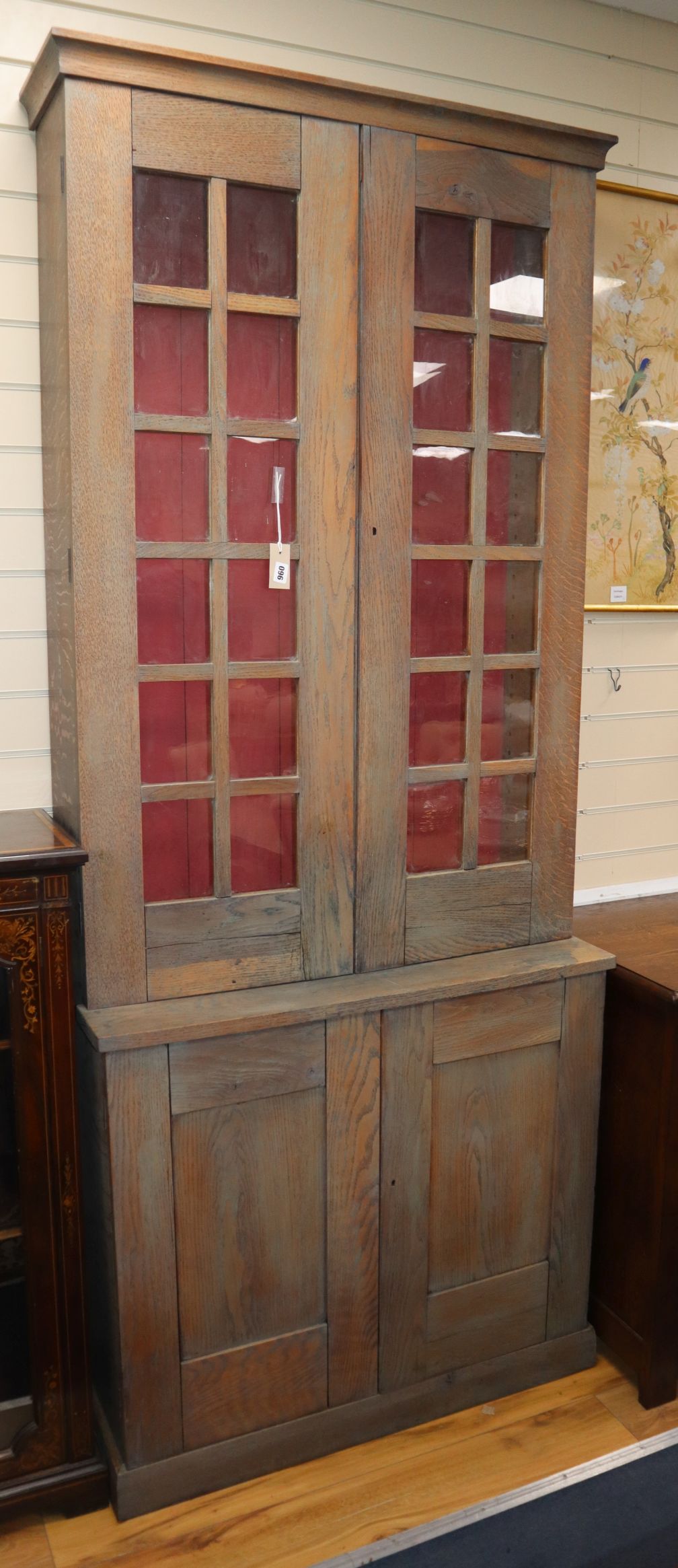 A limed oak narrow bookcase H.228cm