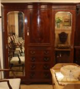 An Edwardian marquetry inlaid mahogany triple wardrobe W.186cm