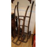 Two wrought iron porters trolleys from 'Harveys Brewery'