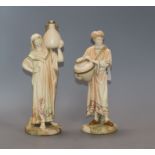 A pair of Royal Worcester blush water carriers