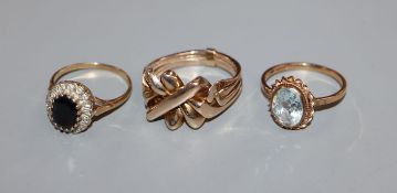 Two 9ct gold gem set rings and one other yellow metal ring.