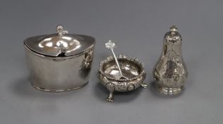 A George III silver mustard pot (a.f.) and spoon, a Victorian silver pepperette and a silver salt