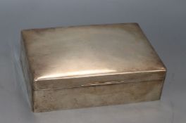 A large George V silver cigarette/cigar box by Goldsmiths & Silversmiths Co Ltd, London, 1934, 24.