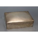 A large George V silver cigarette/cigar box by Goldsmiths & Silversmiths Co Ltd, London, 1934, 24.