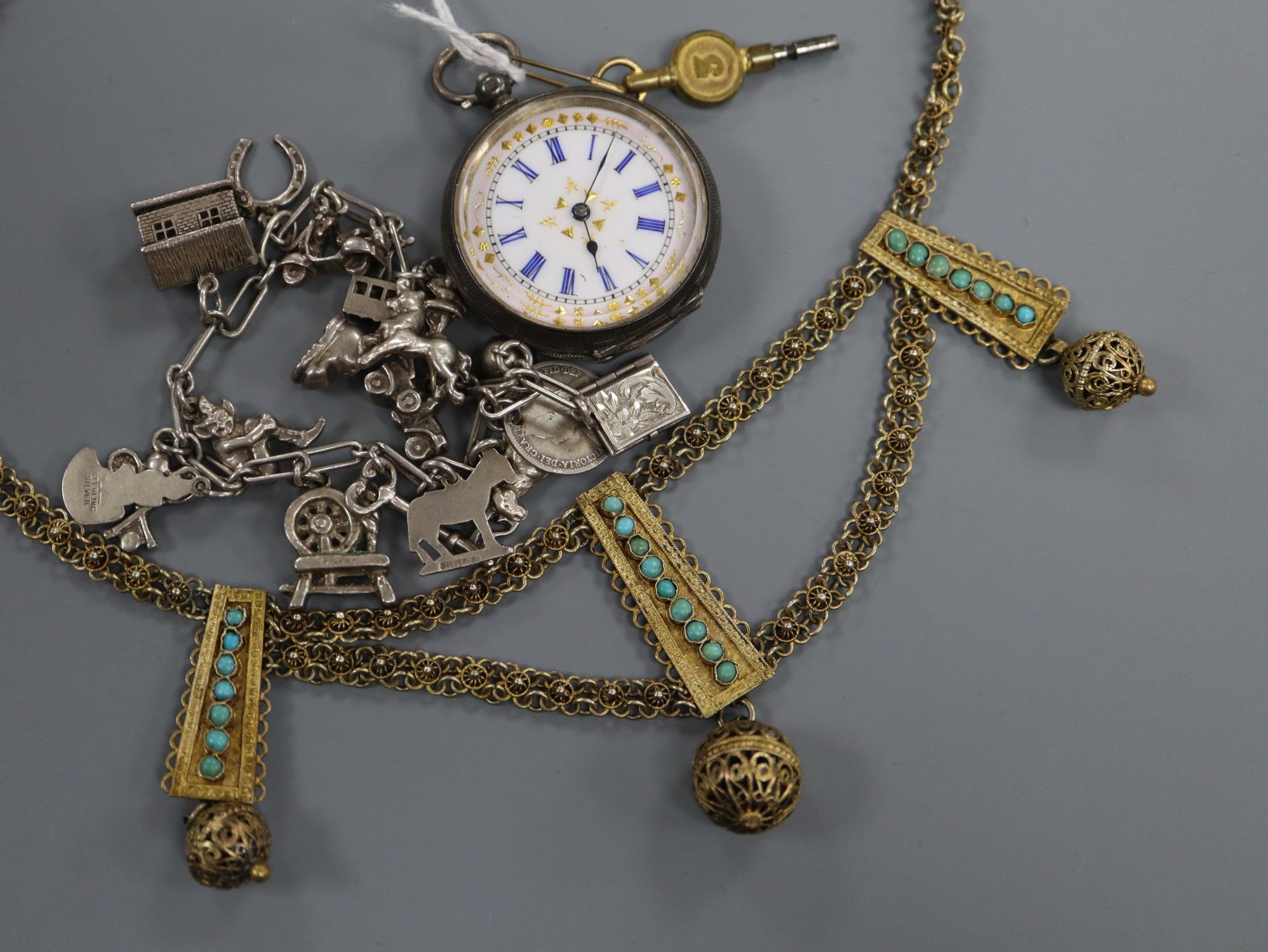 A ladys' silver open face fob watch, a silver charm bracelet and an Eastern plated turquoise-set