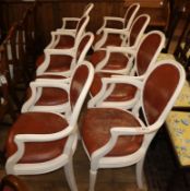 A set of eight Adam style open armchairs, with white-painted moulded frames and leather-
