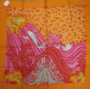 Two Hermes silk scarves, 'A Contre Courante' (orange border) and 'Chapeau' (brown ground), the