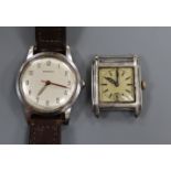 A 1950's stainless steel wristwatch retailed by Garrard and a 935 sterling wrist watch ( no strap).