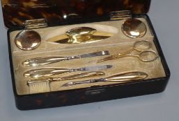 An Edwardian silver gilt manicure set, maker HA, London, 1905/6/7 in Asprey tortoiseshell box,