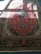 A Heriz style carpet 320 x 206cm