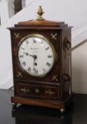 A Regency brass inlaid mahogany bracket clock, by W.M. Reeve of London height 40cm