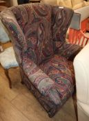 A Victorian wingback armchair