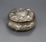 An Egyptian embossed white metal circular trinket box, (a.f.), 13.8cm.