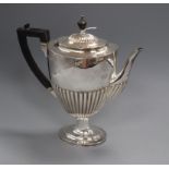 A Victorian demi fluted silver pedestal coffee pot by Edward Hutton, London, 1884, height 28.5cm,