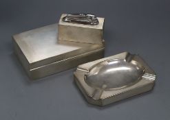 A modern Asprey & Co engine turned silver smoker's set, comprising engine turned cigarette box,