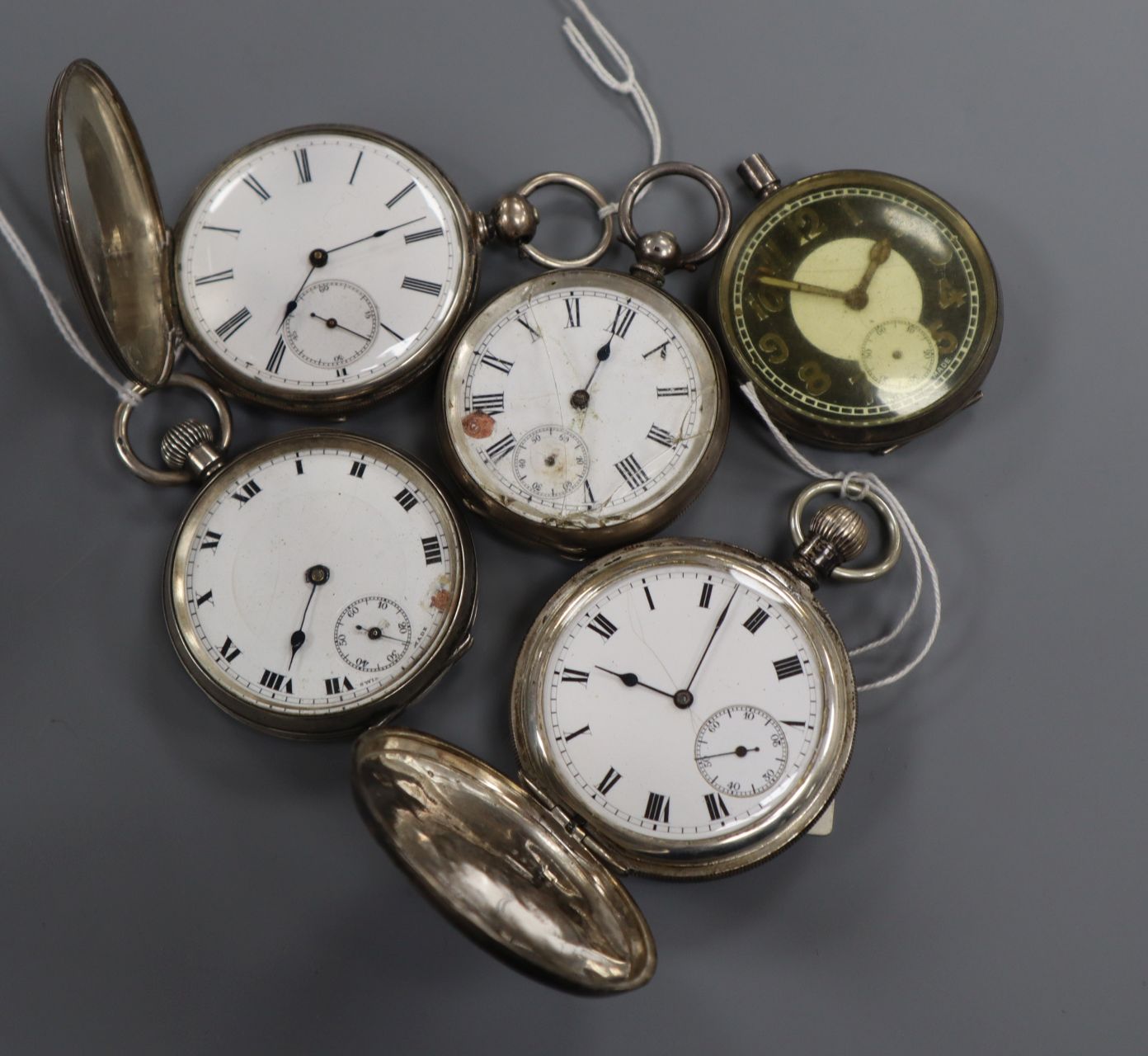 Five assorted silver pocket watches including a hunter.