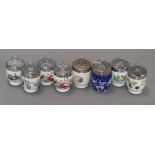 Thirty-five Royal Worcester small porcelain egg coddlers, variously decorated, including two