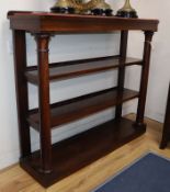 A Victorian rosewood three tier open bookcase W.122cm