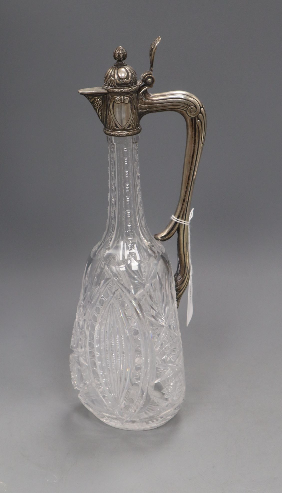 A Russian 84 zolotnik white metal mounted cut glass claret jug, 35.5cm.