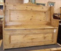 A Victorian pine box seat settle W.133cm