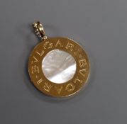 A Bulgari 18ct gold, steel and mother of pearl disc pendant (lacking necklace but in original