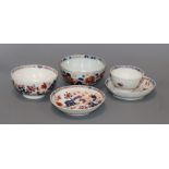 Two Lowestoft Imari 'Two Bird' pattern tea bowls, a similar saucer, a 'Dolls House' pattern saucer