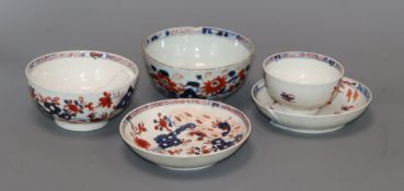 Two Lowestoft Imari 'Two Bird' pattern tea bowls, a similar saucer, a 'Dolls House' pattern saucer