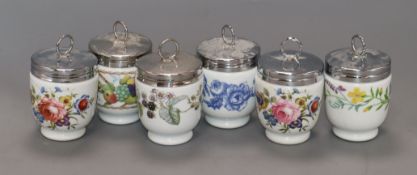 Eighteen Royal Worcester porcelain egg coddlers, including souvenir and commemorative examples