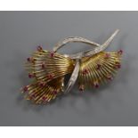 A 20th century Italian 750, ruby and diamond set stylised spray brooch, 56mm,.