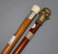 A bailiff's walking stick and sovereign case stick