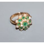 A 9ct gold, emerald and seed pearl cluster ring, size L.