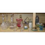 A group of glasswares including decanters, paperweights etc.