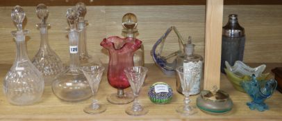 A group of glasswares including decanters, paperweights etc.