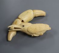 A Japanese ivory okimono of a kingfisher, early 20th century, with mother-of-pearl and horn inset