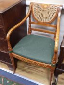 A pair of Sheraton design satinwood elbow chairs
